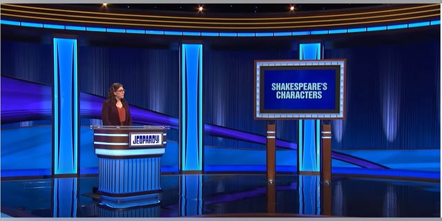 Mayim Bialik at the podium on Jeopardy for the final category