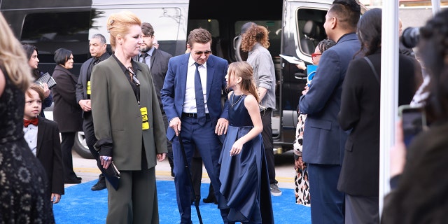 Jeremy Renner with Ava on the red carpet