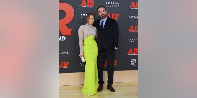 Jennifer Lopez posing with Ben Affleck