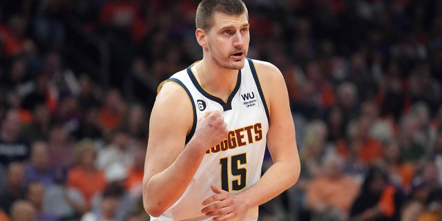 Nikola Jokic looks on