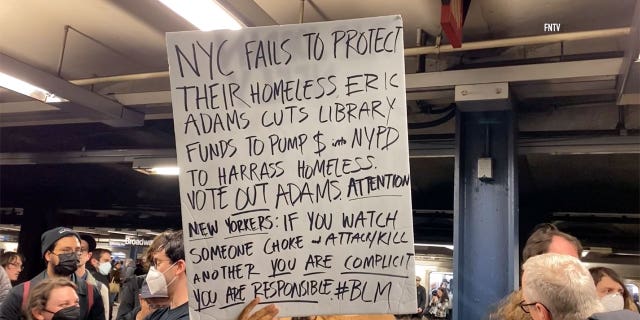 Protestors hold signs during Jodan Neely protest in New York City