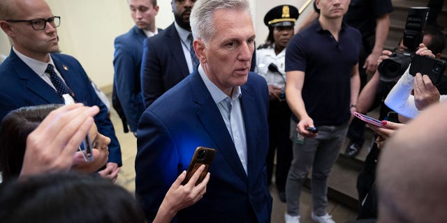 House Speaker Kevin McCarthy is surrounded by reporters