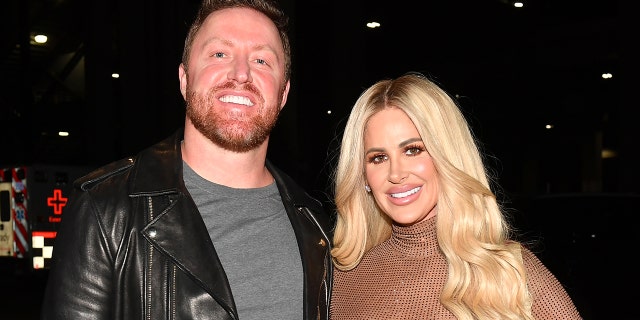 Kroy Bierman posing with Kim Zolciak