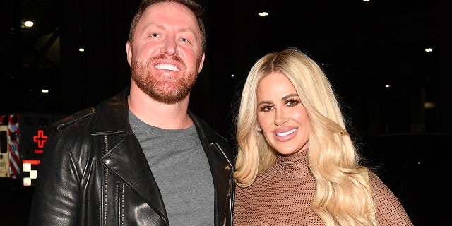 Kim Zolciak wears nude bodysuit, Kroy Biermann sports grey shirt and leather jacket