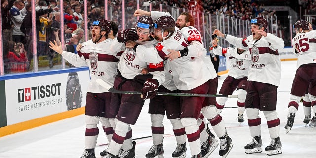 Latvia celebrates IIHF win