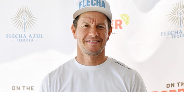 Mark Wahlberg smiles as he appears at a restaurant to promotes his tequila brand.