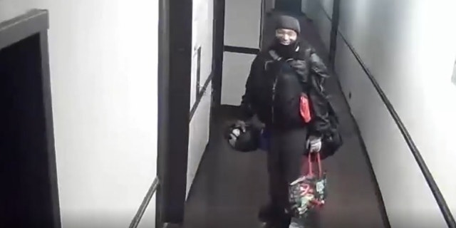 Rape suspect standing in hallway