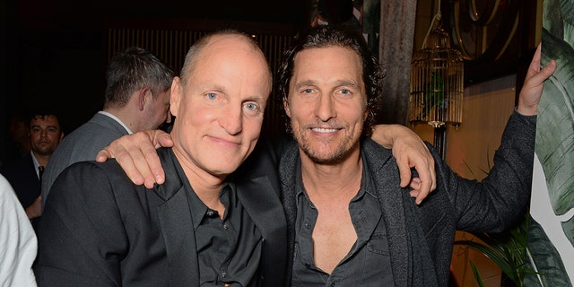 Woody Harrelson with his arm around Matthew McConaughey