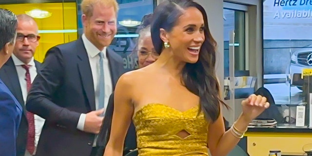 Meghan Markle flashes a smile ahead of feminist event in New York