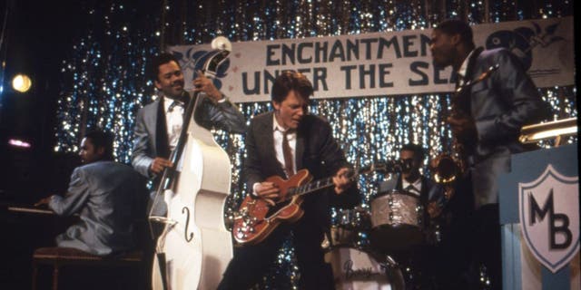A shot from "Back to the Future" that shows Michael J. Fox's character performing with a band during prom.