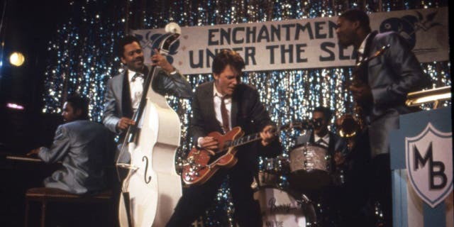 A shot from "Back to the Future" that shows Michael J. Fox's character performing with a band during prom.