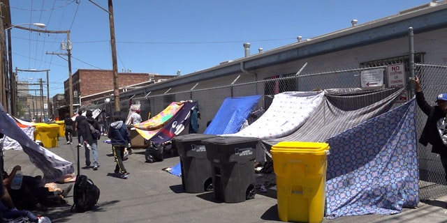 Makeshift tents in downtown house migrants
