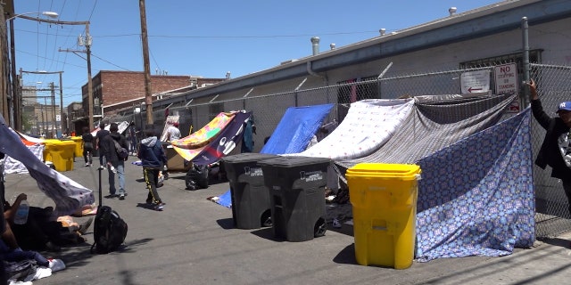 Makeshift tents in downtown house migrants