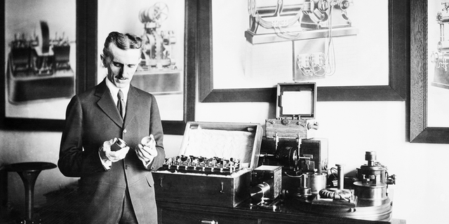 Nikola Tesla with Tesla coil