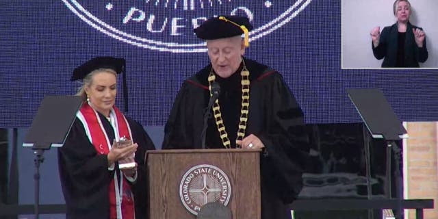 Dana being given trophy at CSU