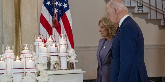 President Joe Biden and First Lady Jill Biden stand by a memorial for the 21 victims of the 2022 mass shooting in Uvalde, Texas, at the White House