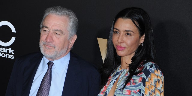 Robert De Niro with his eldest daughter Drena, on the red carpet looking away from the camera at the Hollywood Film Awards