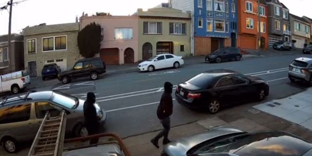 Suspects walking down street in all black