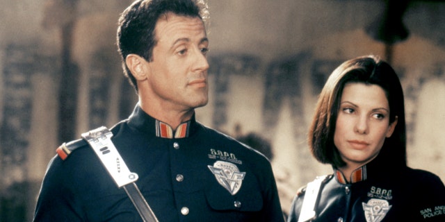 Sandra Bullock and Sylvester Stallone filming a scene for "Demolition Man"
