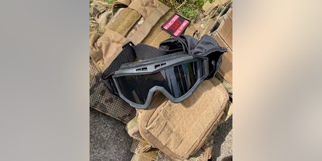 tactical vest and goggles