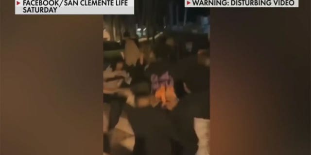 Teens surround Marines on the ground