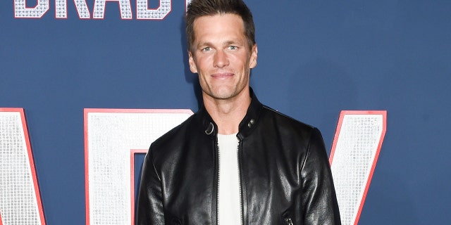 Tom Brady wears leather jacket and white T-shirt on red carpet of film premiere