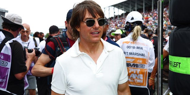 Tom Cruise wears white polo shirt and sunglasses at F1 Grand Prix in Miami