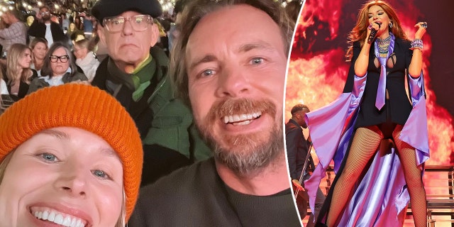 Kristen Bell in an orange beanie smiles with Dax Shepard at the Shania Twain concert at the Hollywood Bowl with Tom Hanks photobombing in the background split Shania Twain on stage performing with fire imagery around her