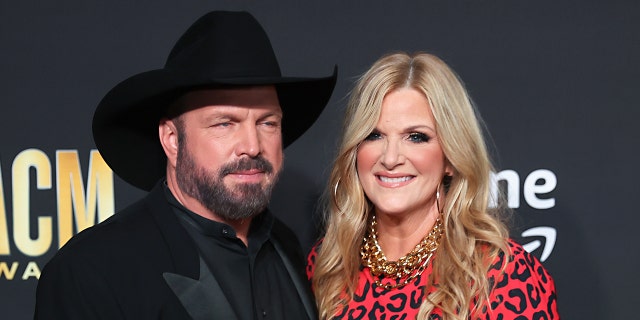 Trisha Yearwood smiling with Garth Brooks