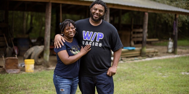Jordan Davis and Ameal Woods stand outside in Mississippi