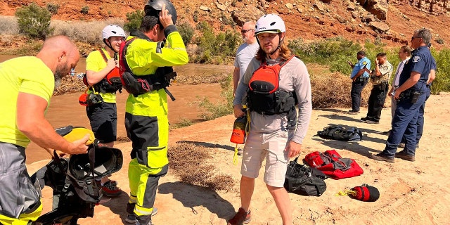 rescuers on riverbank