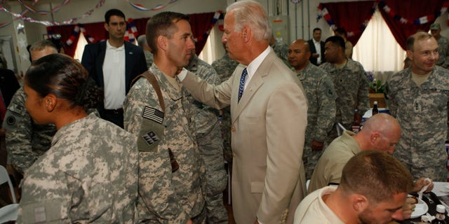 Then-vice president Joe Biden greets his son U.S. Army Capt. Beau Biden at Camp Victory on July,4, 2009 near Baghdad, Iraq