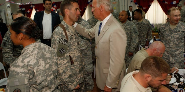 Then-vice president Joe Biden greets his son U.S. Army Capt. Beau Biden at Camp Victory on July,4, 2009 near Baghdad, Iraq