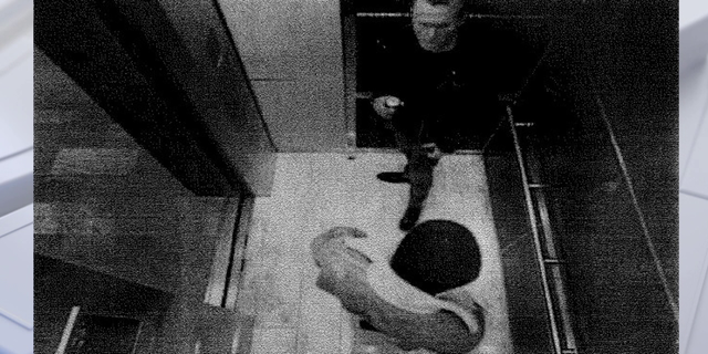 Bob Lee with Nima Momeni on black and white surveillance video in an elevator
