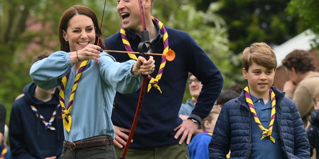 Kate Middleton smiles while practicing archery