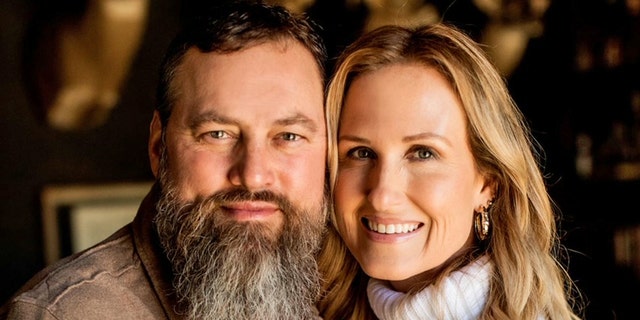 willie and korie robertson embracing close-up