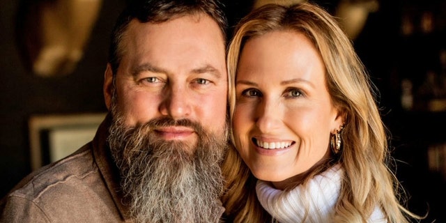 willie and korie robertson embracing close-up