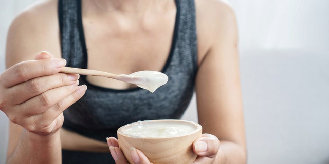 Woman eating yogurt