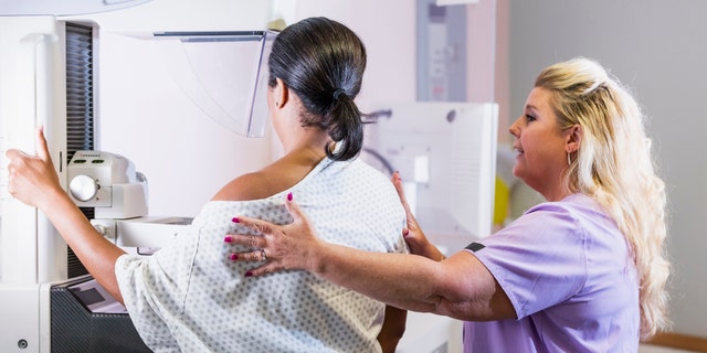 Woman getting mammogram