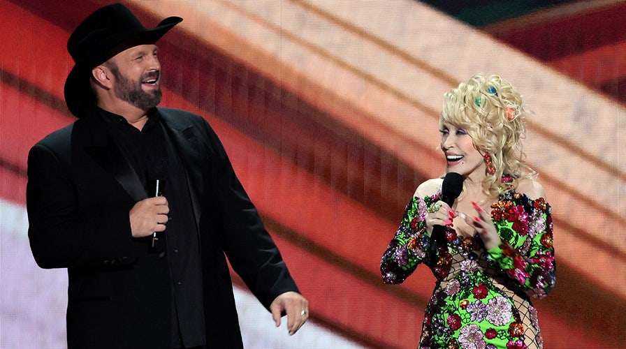 Dolly Parton reveals why she has to be nice to ACM Awards co-host Garth Brooks