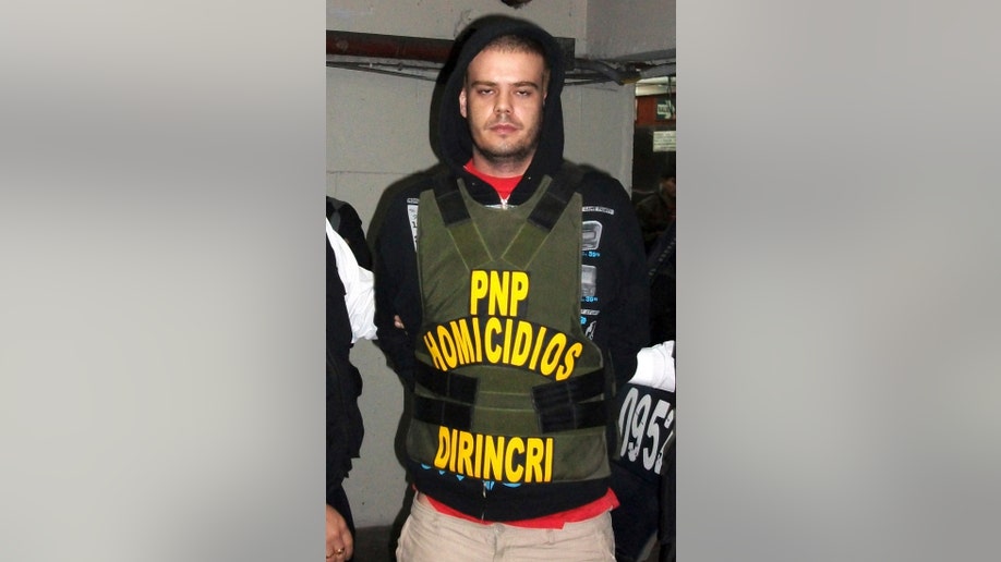 Joran Van der Sloot of the Netherlands is transferred by the police from the police headquarters to the prosecutor's office in Lima