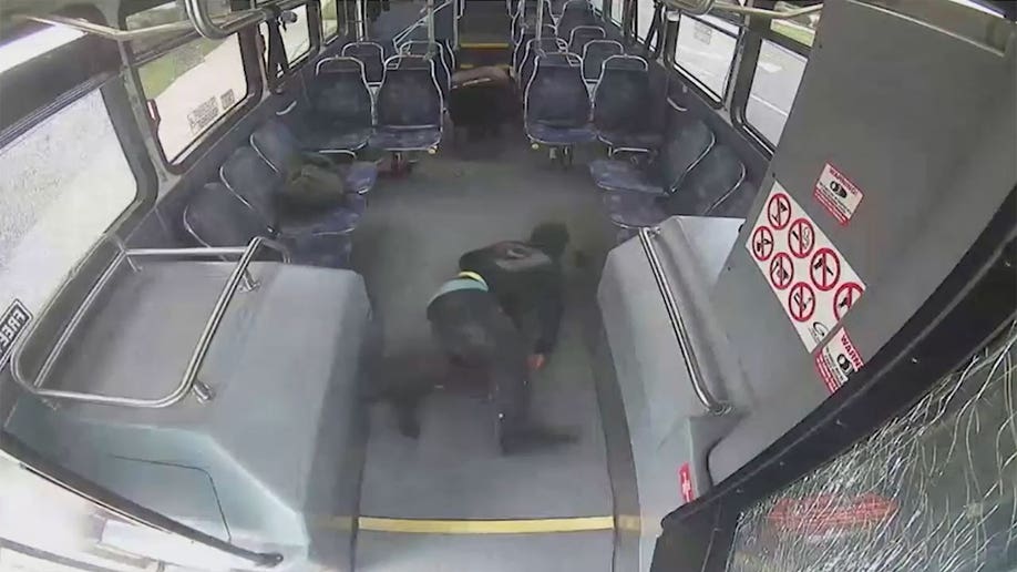 Man sprawled out on the floor as other passengers crawl away.