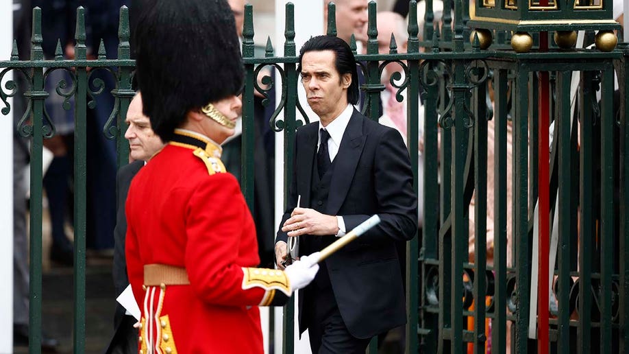 Nick Cave departs the coronation of King Charles III and Queen Camilla.