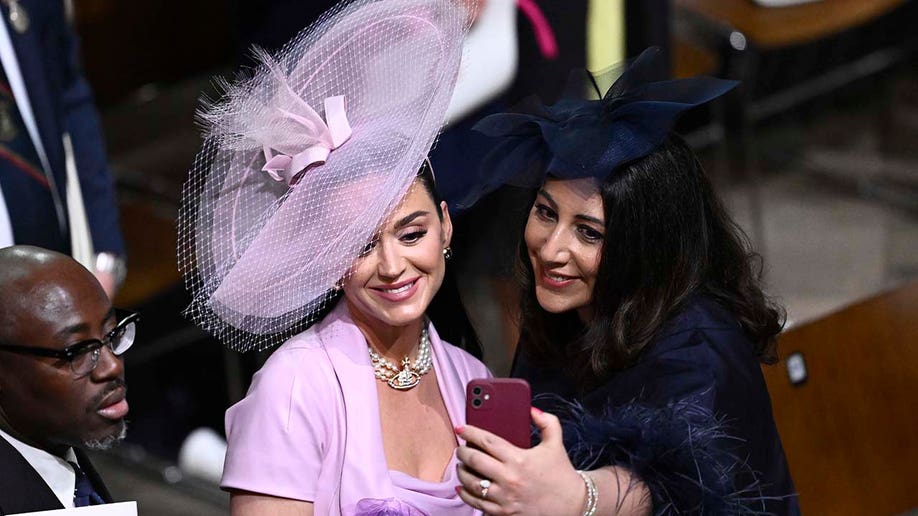 Edward Enninful, Katy Perry and Nadia El-Nakla take a selfie inside Westminster Abbey