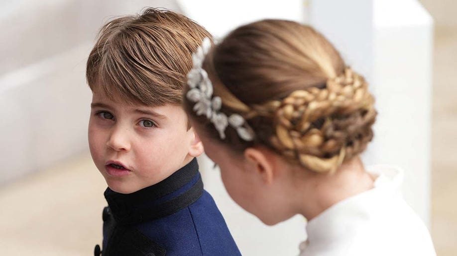 Prince Louis and Princess Charlotte arrive for the coronation ceremony