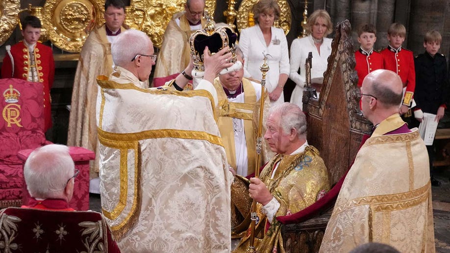 King Charles III is crowned with St Edward's Crown by The Archbishop of Canterbury the Most Reverend Justin Welby