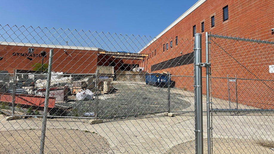 Meade Senior High School behind a metal gate.