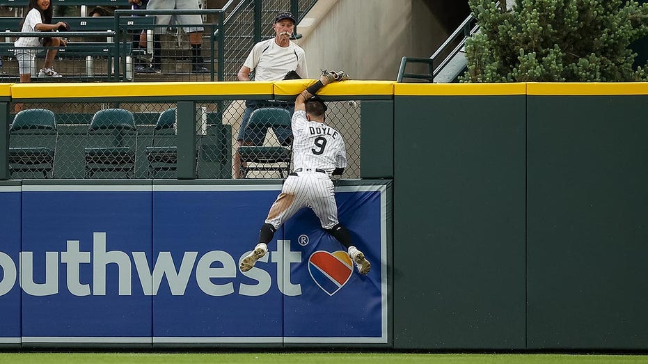 Rockies’ Brenton Doyle carted off the field after colliding with wall in attempt to rob 9th-inning home run
