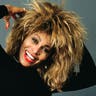 Tina Turner posing in a silly way for the camera