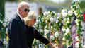FILE - President Joe Biden and first lady Jill Biden visit a memorial at Robb Elementary School to pay their respects to the victims of the mass shooting, May 29, 2022, in Uvalde, Texas. Biden will speak at a summit in Connecticut on Friday, June 16, 2023, to mark the first anniversary of a gun safety law signed after the school massacre in Uvalde, Texas. (AP Photo/Evan Vucci)